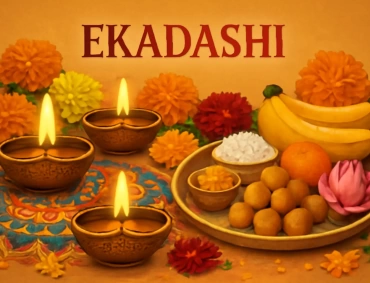 Brass diyas glow beside flowers and prasad plate with bananas, laddus, sabudana, lotus.