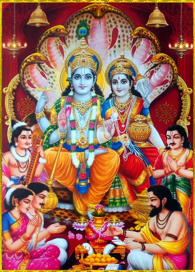 Lakshmi and Vishnu seated on Shesha, richly adorned, surrounded by devotees performing ritual offerings.