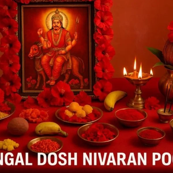 Ritual setup for Mangal Dosh Nivaran Pooja with deity image, lamps, flowers, powders, offerings.