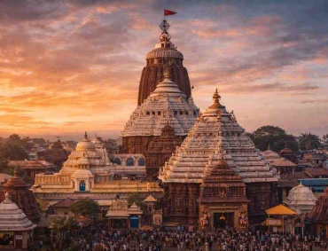 Jagannath Temple in Puri at sunset, showing the main shikhara with the Sudarshana Chakra and devotees gathered in the temple परिसर
